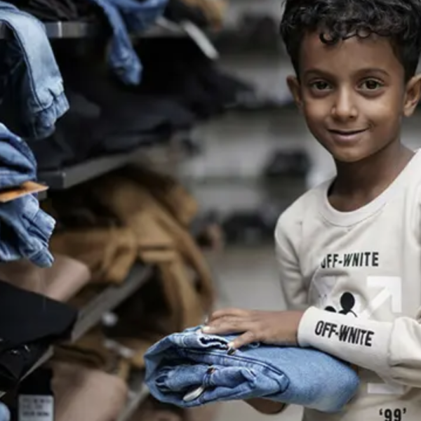 Image: A child in Yemen buys his new Eid clothes as part of our Eid Gifts programme.
