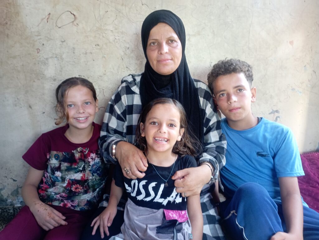 Children and caregiver in Gaza